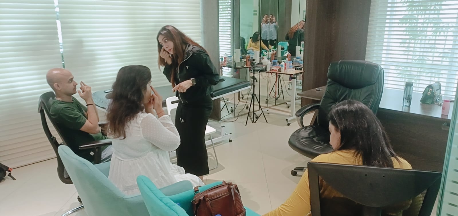 Vibha Jain in conversation with seated participants during a session in a bright, calm room.
